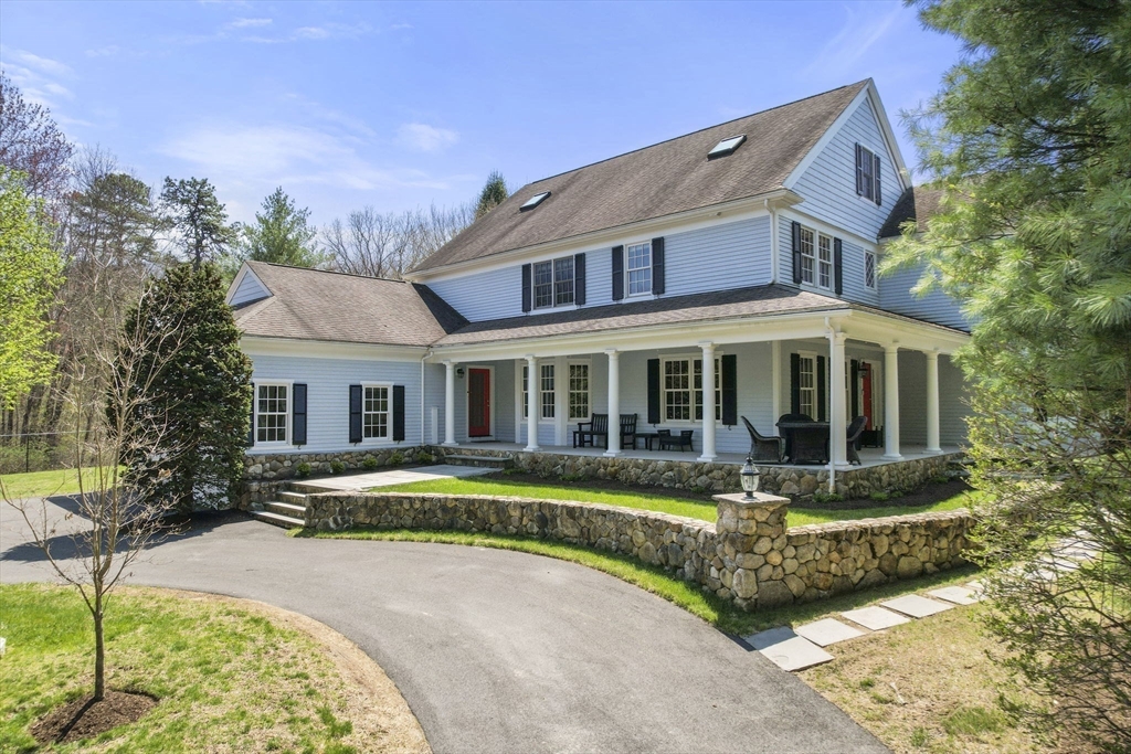 1 Beard Way Wellesley, MA 02482 - Photo 2 of 41 a front view of a house with a yard table and chairs