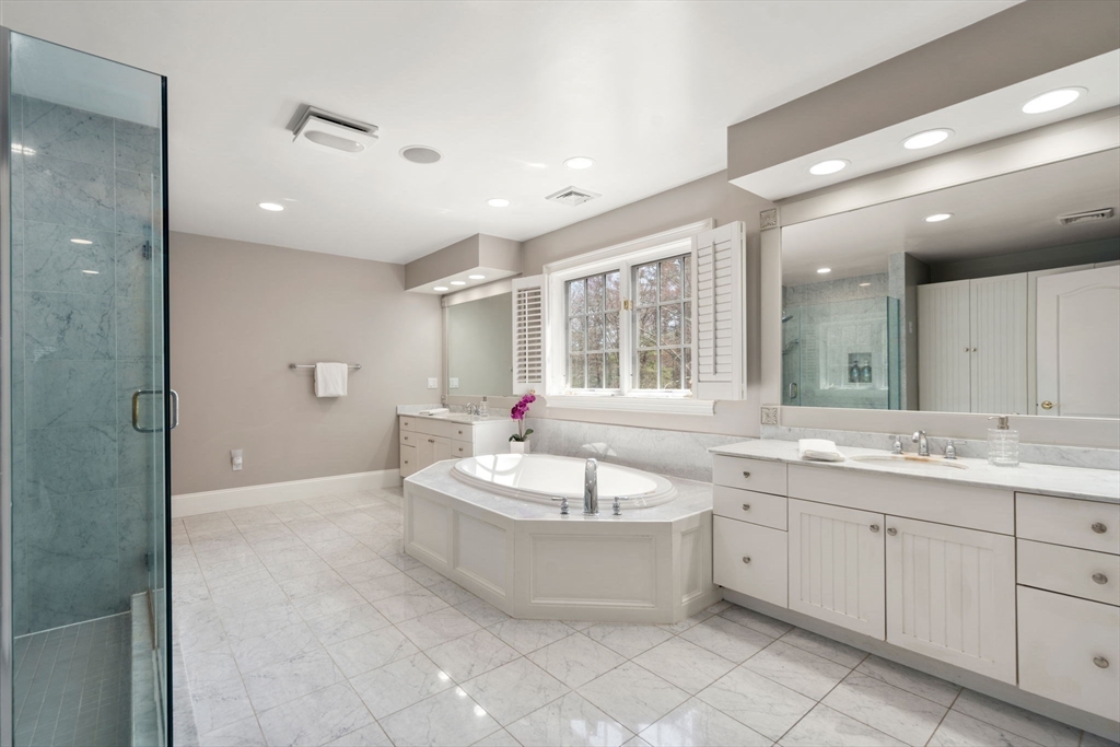 1 Beard Way Wellesley, MA 02482 - Photo 24 of 41 a spacious bathroom with a double vanity sink a mirror and a bathtub