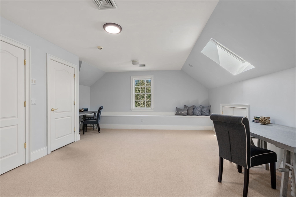 1 Beard Way Wellesley, MA 02482 - Photo 30 of 41 a spacious bedroom with a bed and a desk