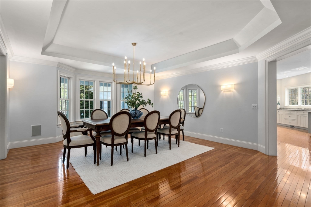 1 Beard Way Wellesley, MA 02482 - Photo 10 of 41 a view of a dining room with furniture a chandelier and wooden floor