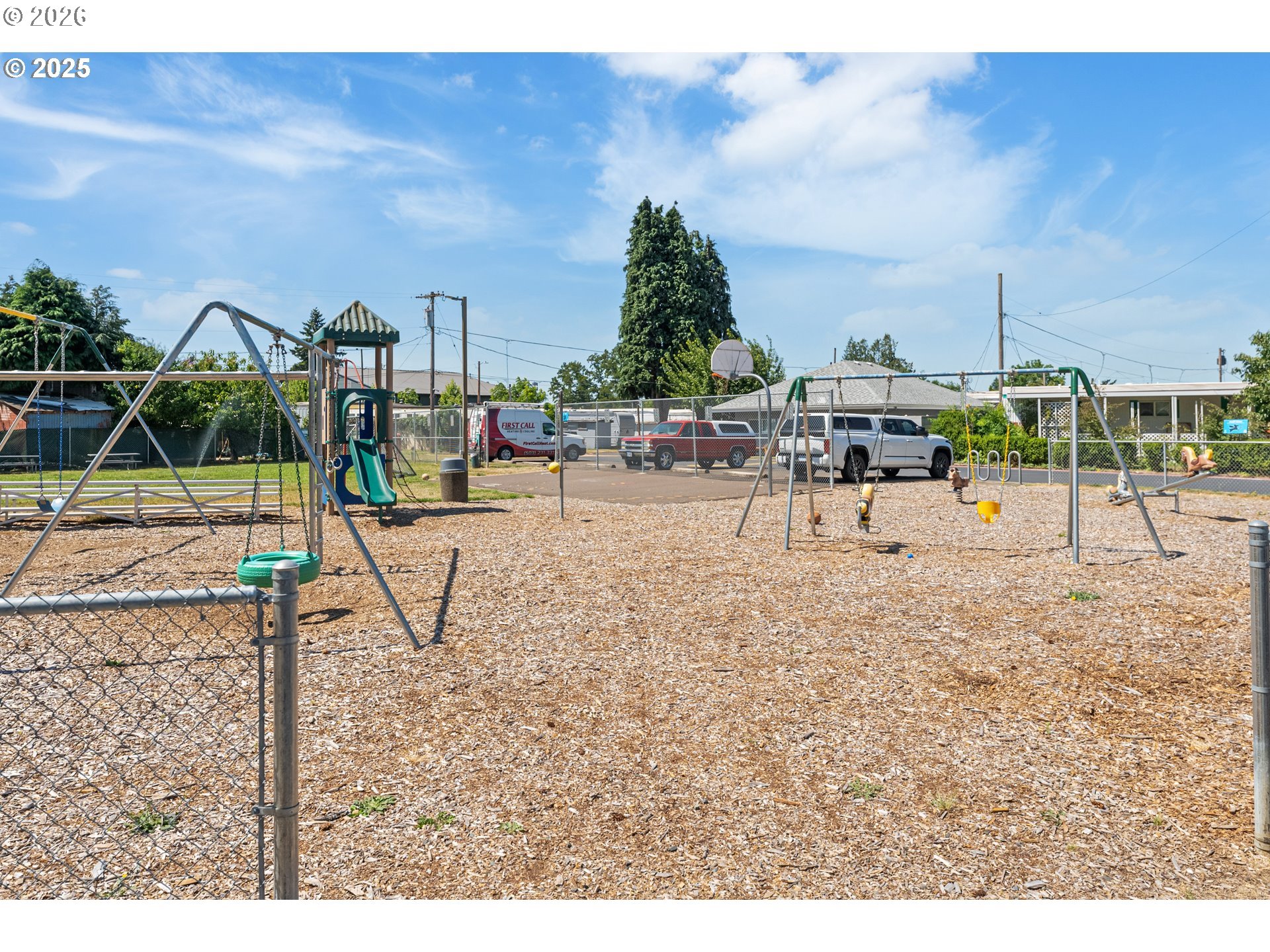 8951 Southeast Fuller Road, Unit 7 Happy Valley, OR 97086 - Photo 21 of 24 a view of a park with swings