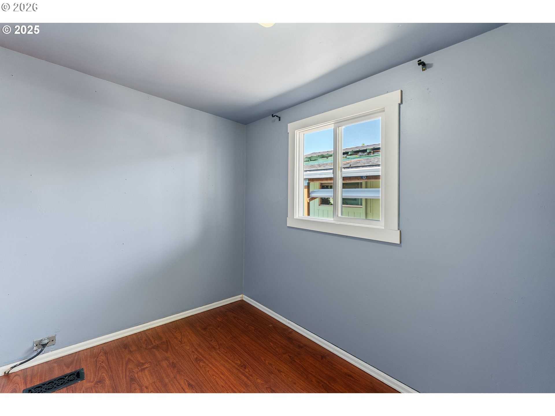 8951 Southeast Fuller Road, Unit 7 Happy Valley, OR 97086 - Photo 9 of 24 a view of an empty room with a window