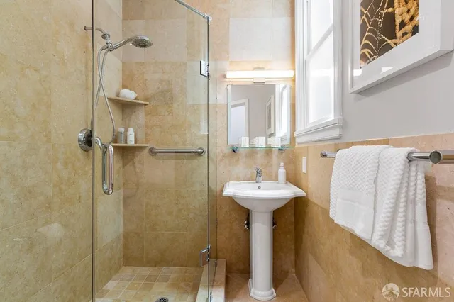 a bathroom with a sink and mirror