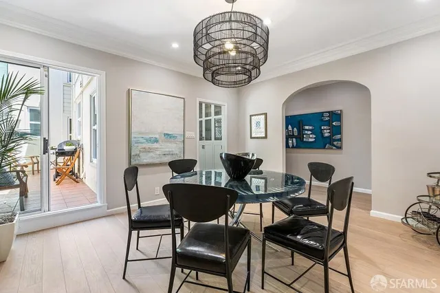 a dining room with furniture a livingroom and chandelier