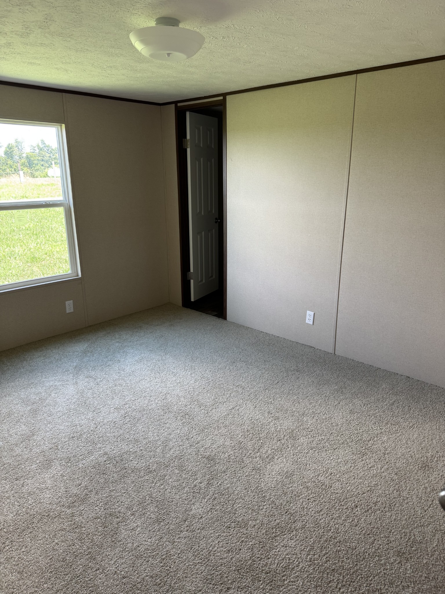 9392 Sunrise Road Red Boiling Springs, TN 37150 - Photo 11 of 12 an empty room with a window
