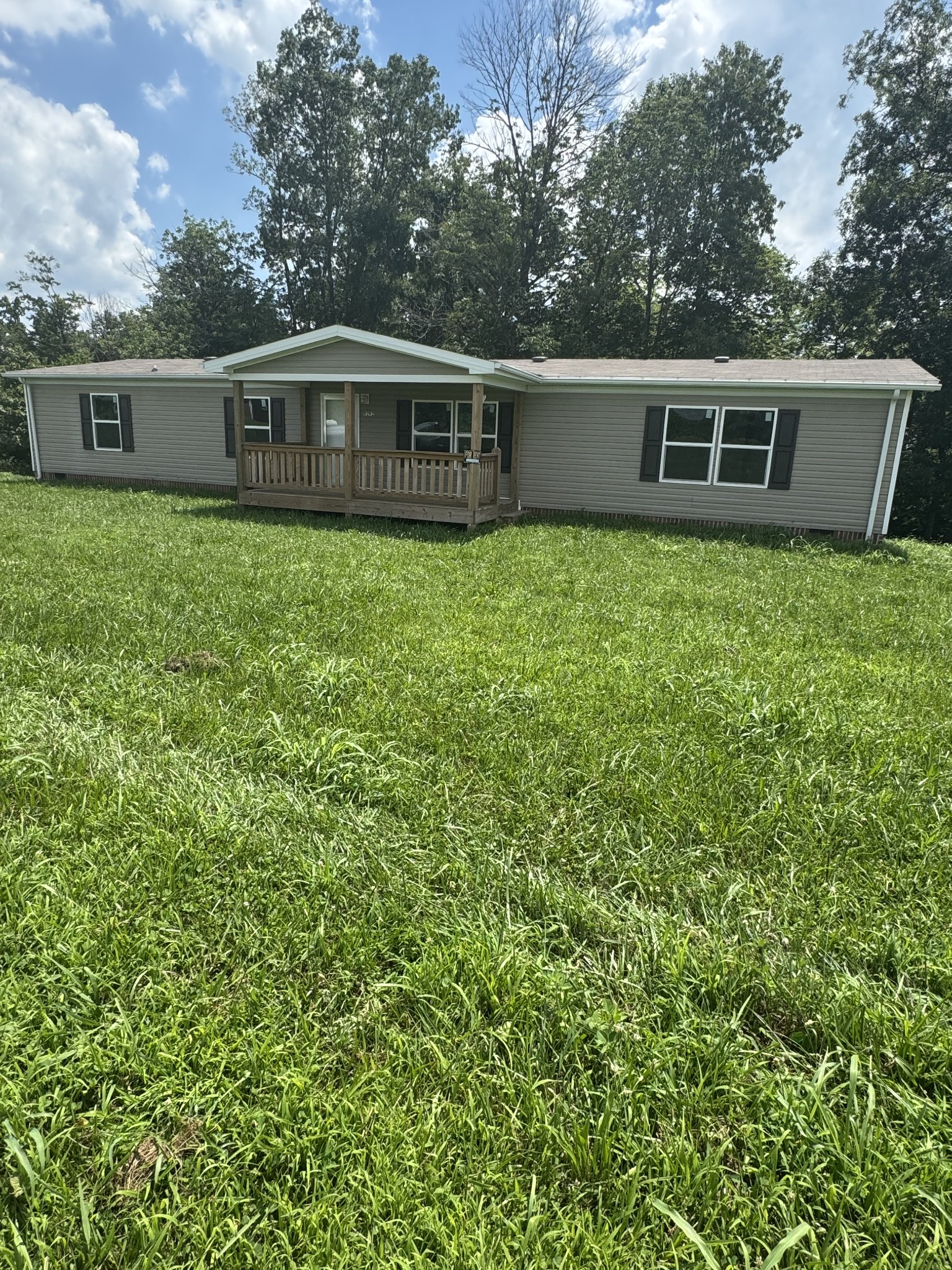 9392 Sunrise Road Red Boiling Springs, TN 37150 - Photo 2 of 12 a view of a house with a backyard