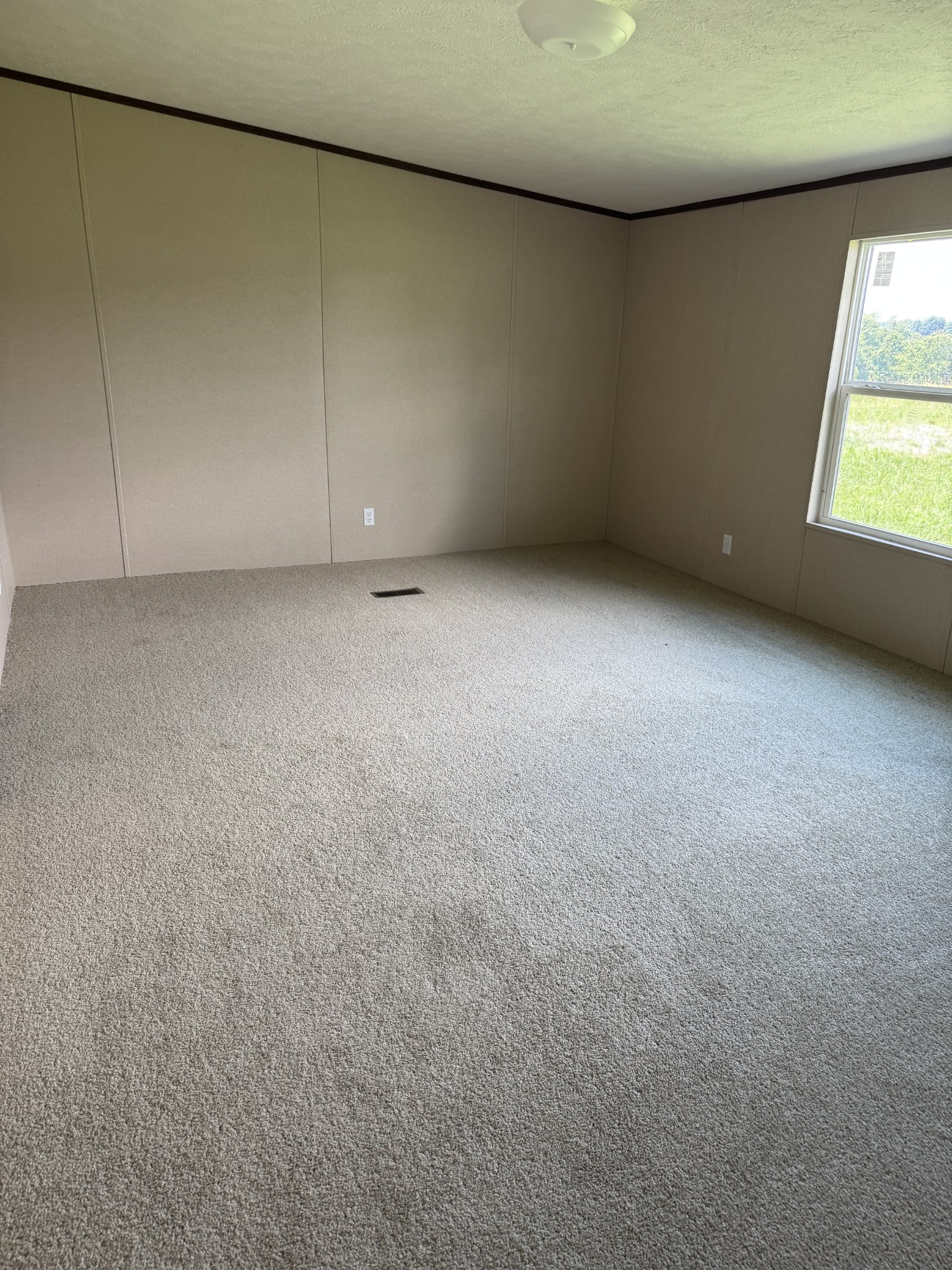 9392 Sunrise Road Red Boiling Springs, TN 37150 - Photo 7 of 12 a view of an empty room with a window