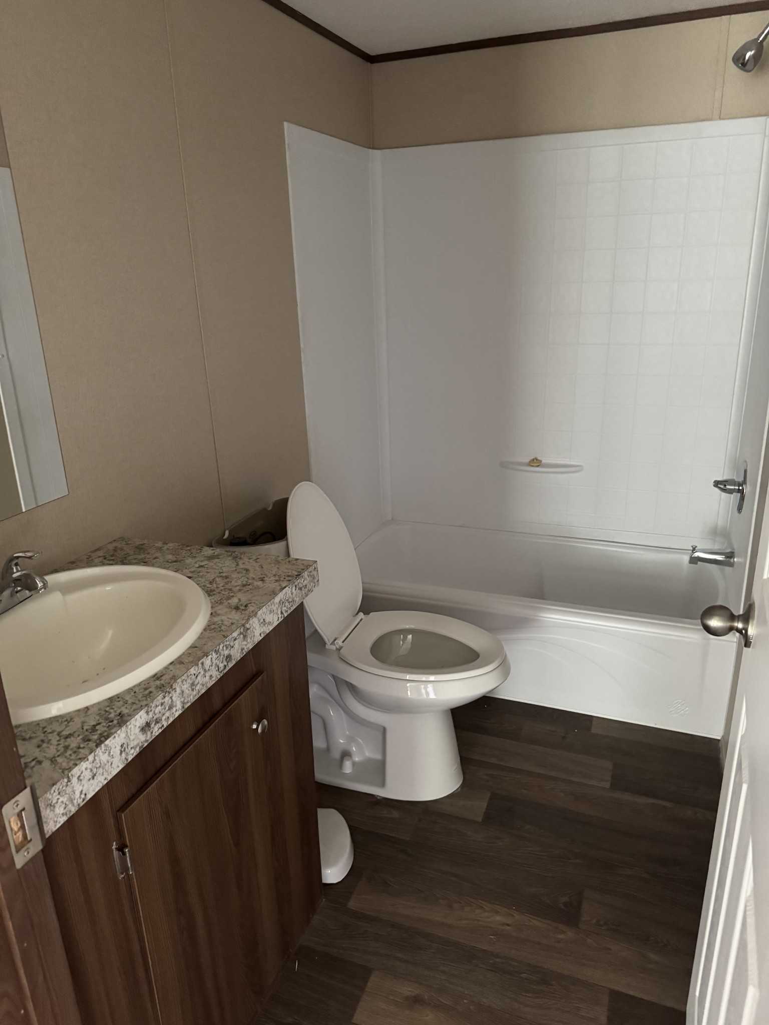 9392 Sunrise Road Red Boiling Springs, TN 37150 - Photo 8 of 12 a bathroom with a granite countertop sink toilet and a mirror