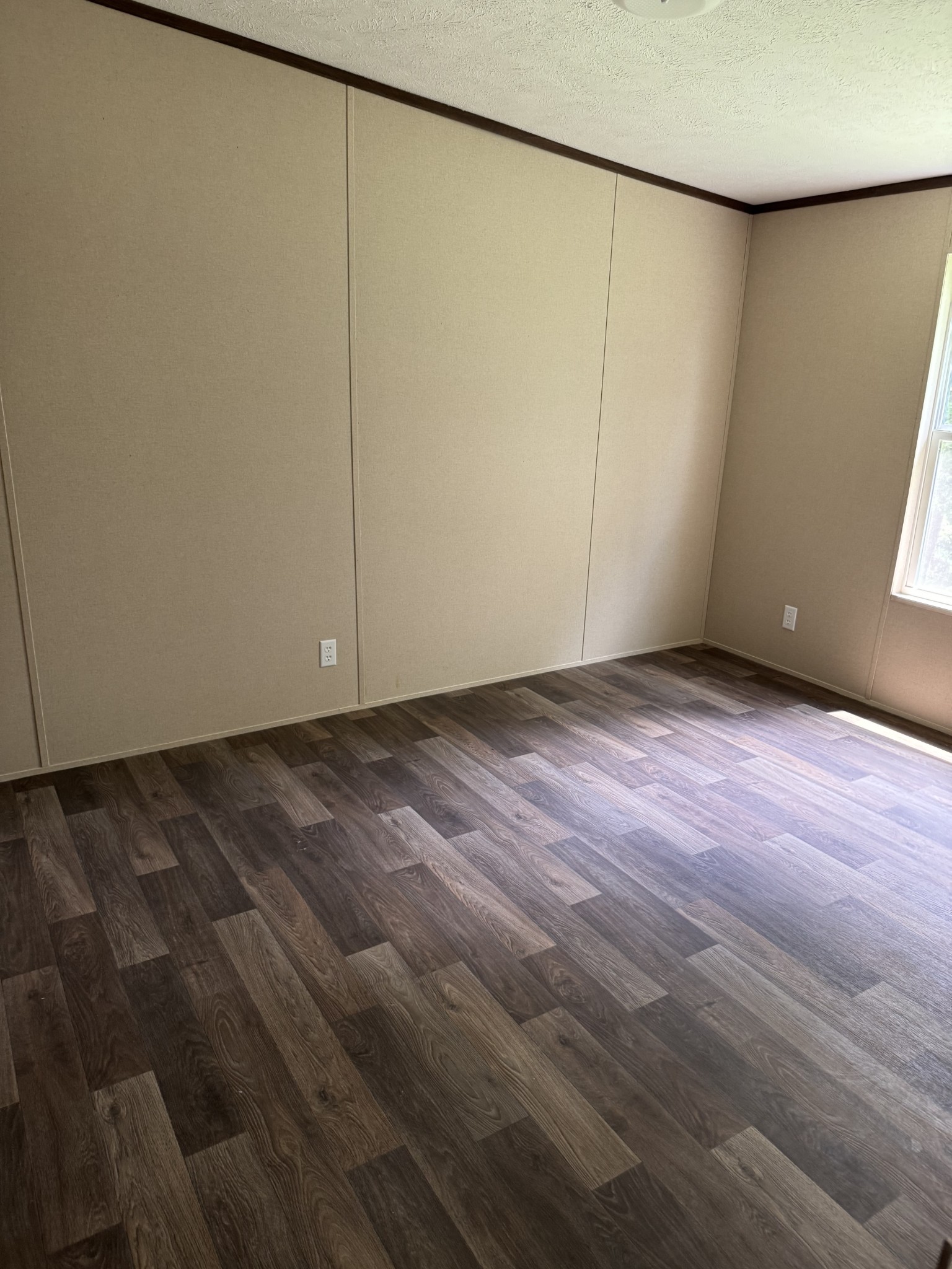 9392 Sunrise Road Red Boiling Springs, TN 37150 - Photo 9 of 12 an empty room with wooden floor