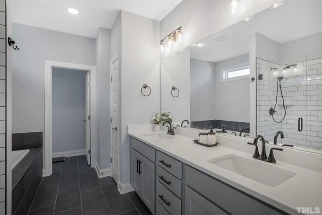 a bathroom with a double vanity sink mirror and double