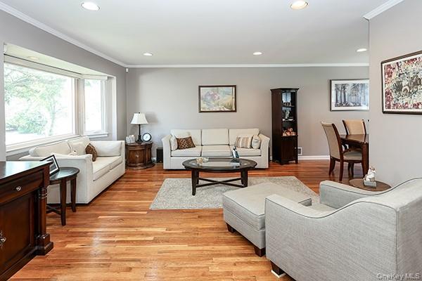 Recessed lighting, wood-finish flooring, bay window