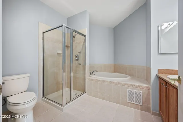 a bathroom with a toilet sink and shower