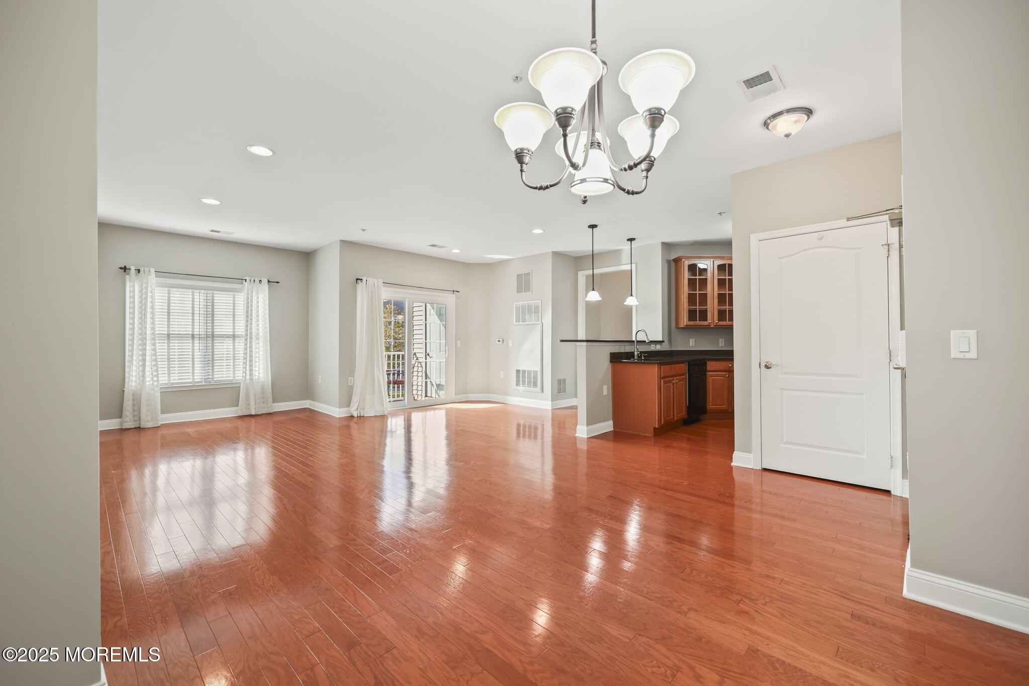 3208 Falston Circle, Unit 3208 Old Bridge, NJ 08857 - Photo 2 of 39 a view of a livingroom with a kitchen chandelier