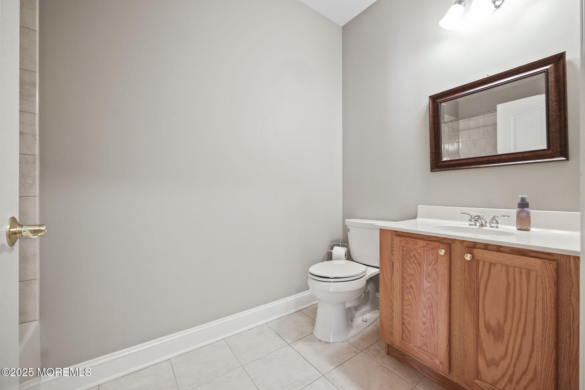 3208 Falston Circle, Unit 3208 Old Bridge, NJ 08857 - Photo 24 of 39 a bathroom with a toilet sink vanity and mirror