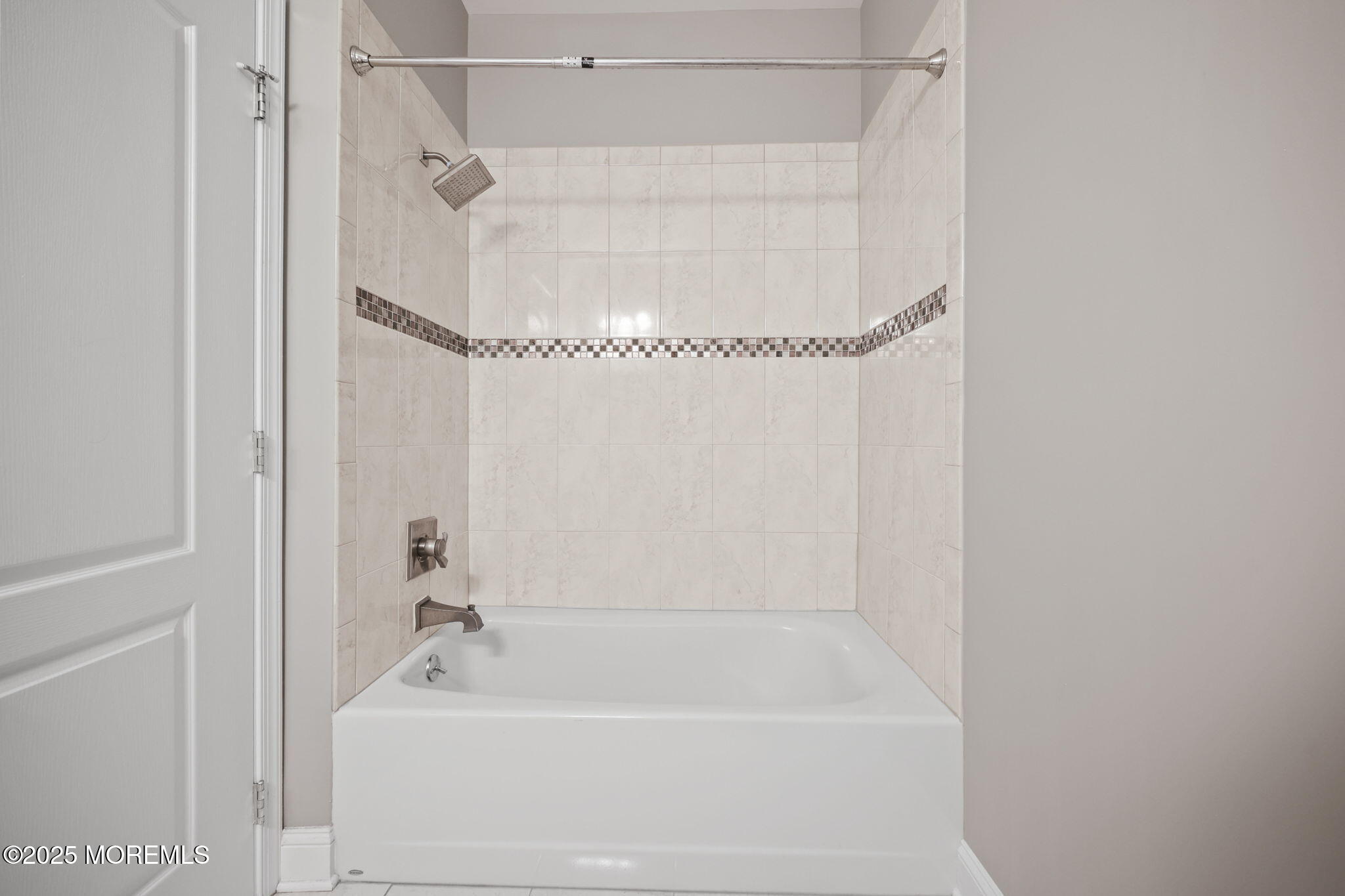 3208 Falston Circle, Unit 3208 Old Bridge, NJ 08857 - Photo 25 of 39 a bathroom with a bathtub and a shower