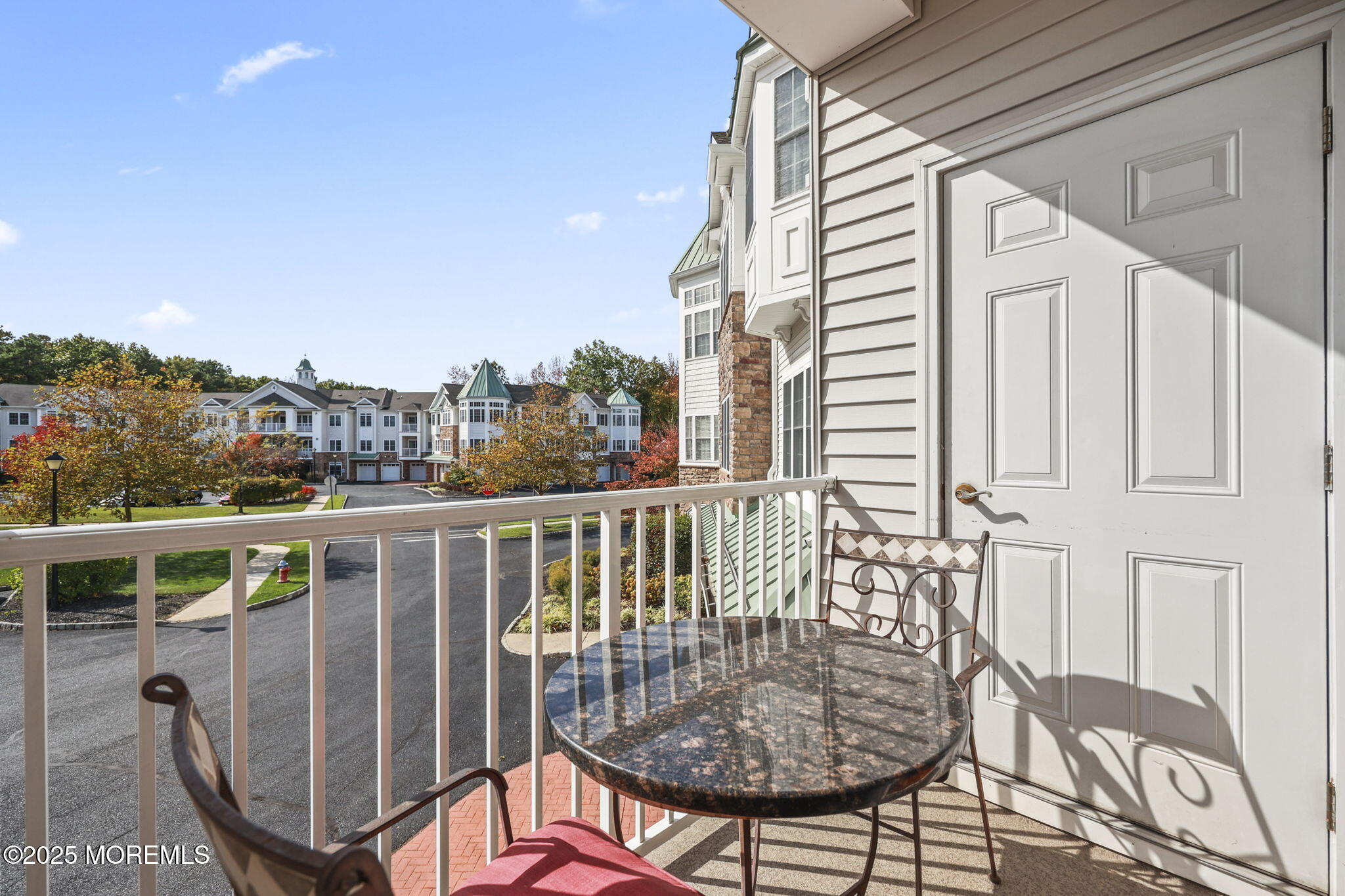 3208 Falston Circle, Unit 3208 Old Bridge, NJ 08857 - Photo 27 of 39 a balcony with table and chairs
