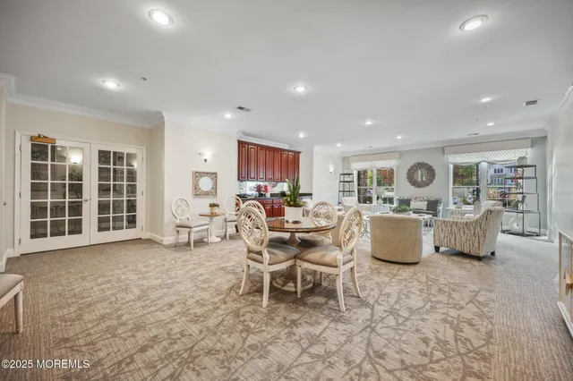 a living room with furniture a window and kitchen view