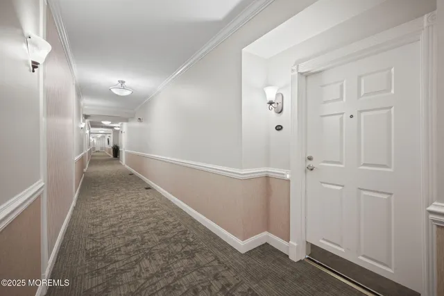 a view of a hallway with closet area
