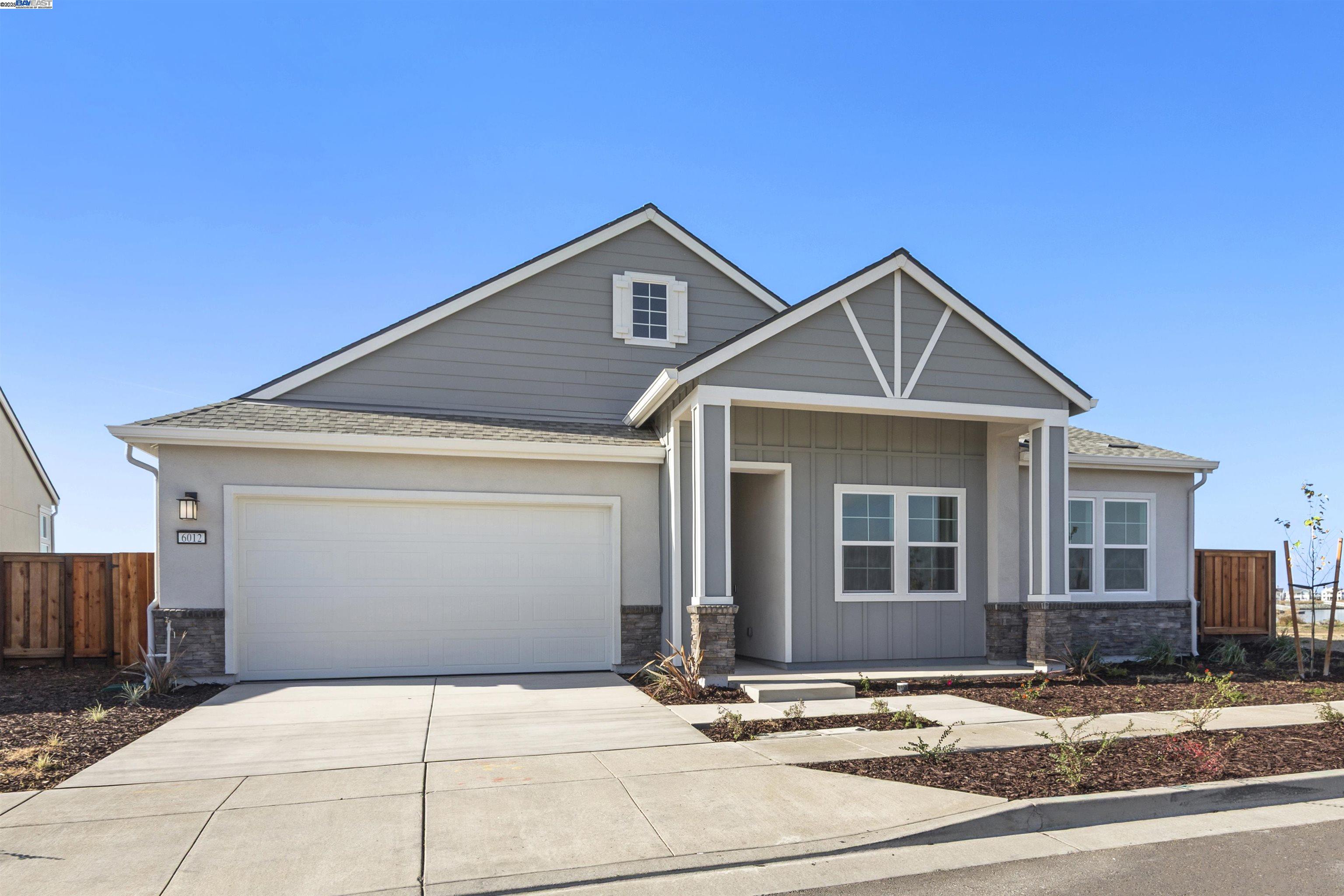 a front view of a house with yard