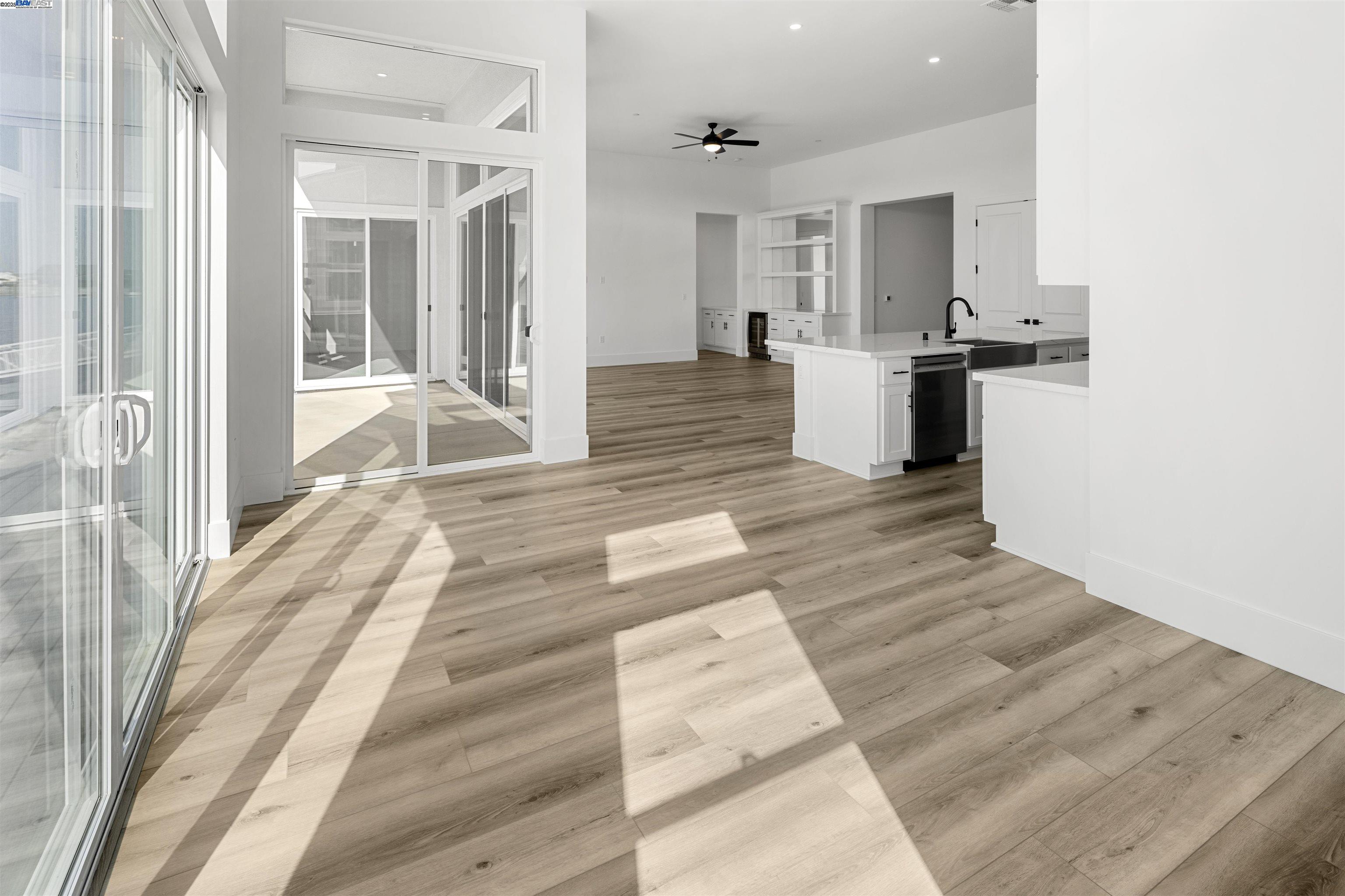 6012 Windsweep Road Bethel Island, CA 94511 - Photo 13 of 33 a view of a kitchen with wooden floor and a sink