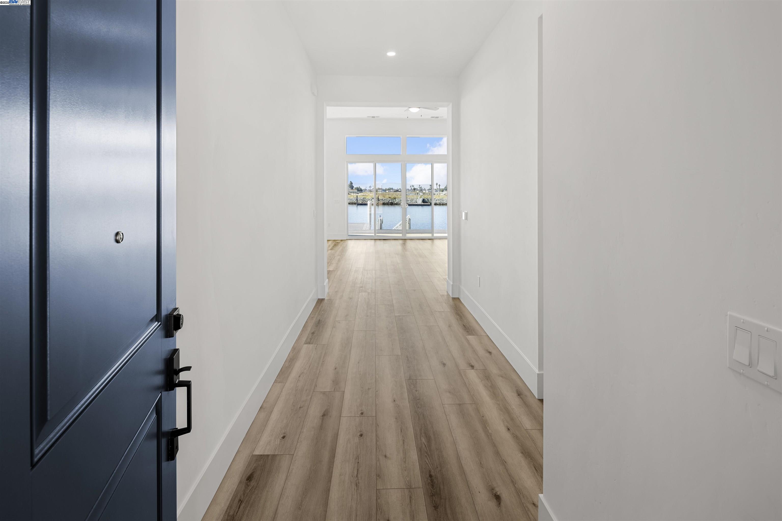 6012 Windsweep Road Bethel Island, CA 94511 - Photo 3 of 33 a view of a hallway with wooden floor and staircase