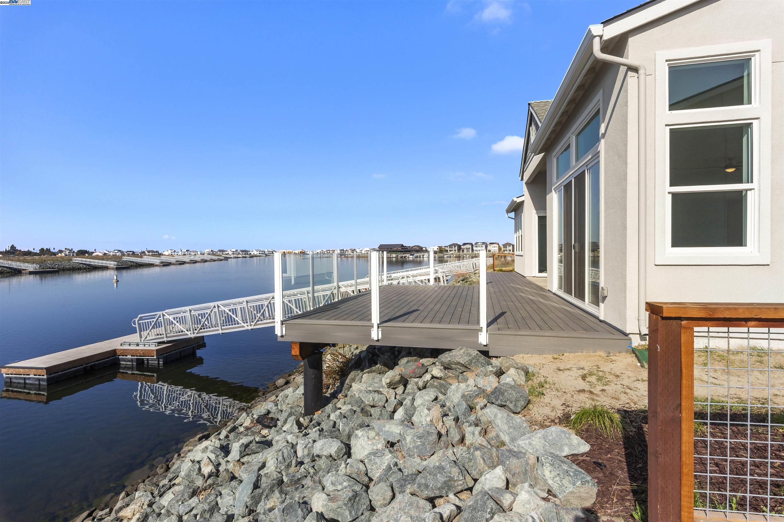 6012 Windsweep Road Bethel Island, CA 94511 - Photo 33 of 33 a roof deck with table and chairs and wooden floor