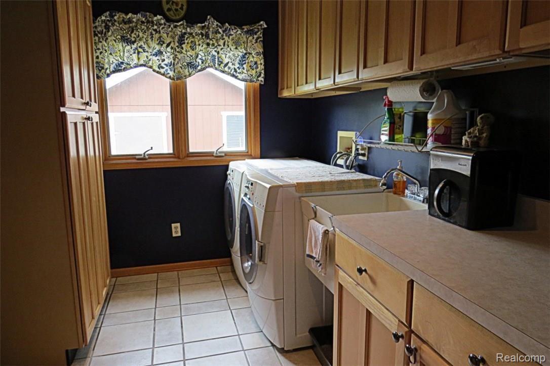 942 South Kern Road Fowlerville, MI 48836 - Photo 40 of 77 Large laundry room off garage with ceramic tile
