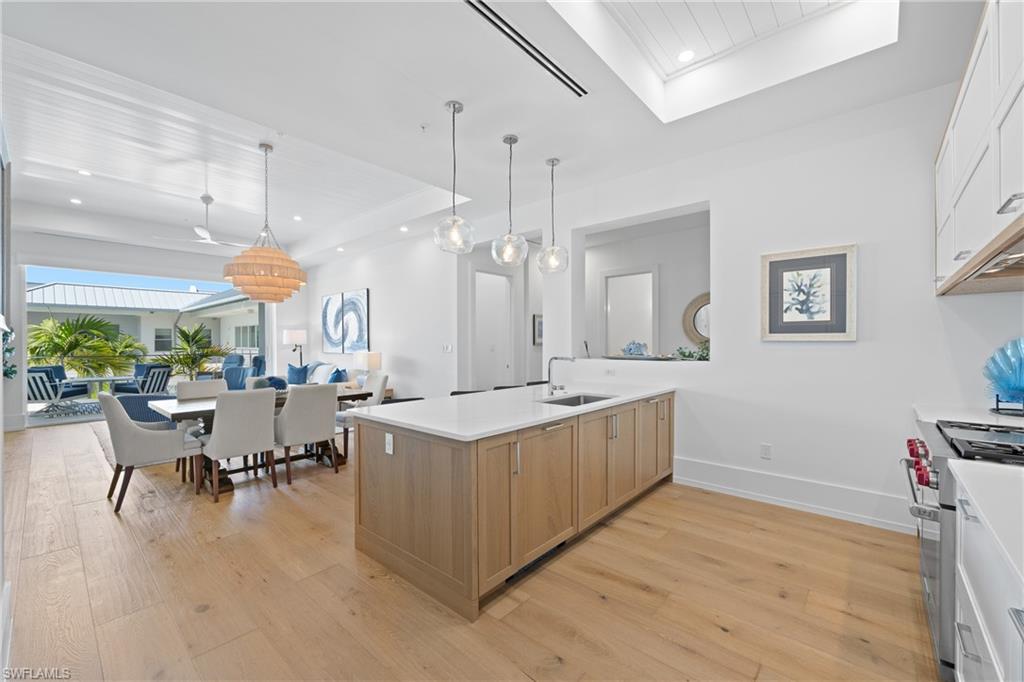 201 8th Street South, Unit 310 Naples, FL 34102 - Photo 13 of 40 a view of a kitchen and dining room
