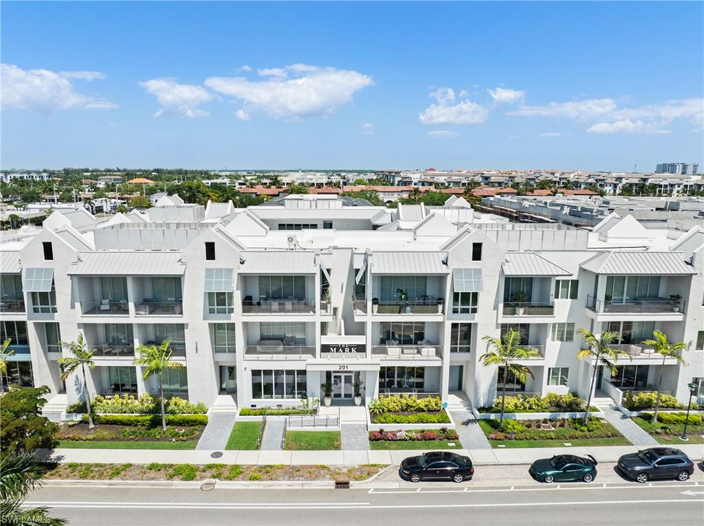 201 8th Street South, Unit 310 Naples, FL 34102 - Photo 31 of 40 a car parked in front of a building