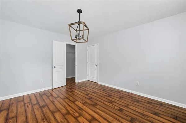 a view of a room with wooden floor and sink