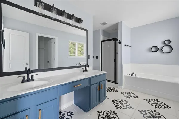 a bathroom with a bathtub and a shower