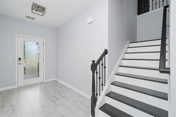 a view of entryway with wooden floor