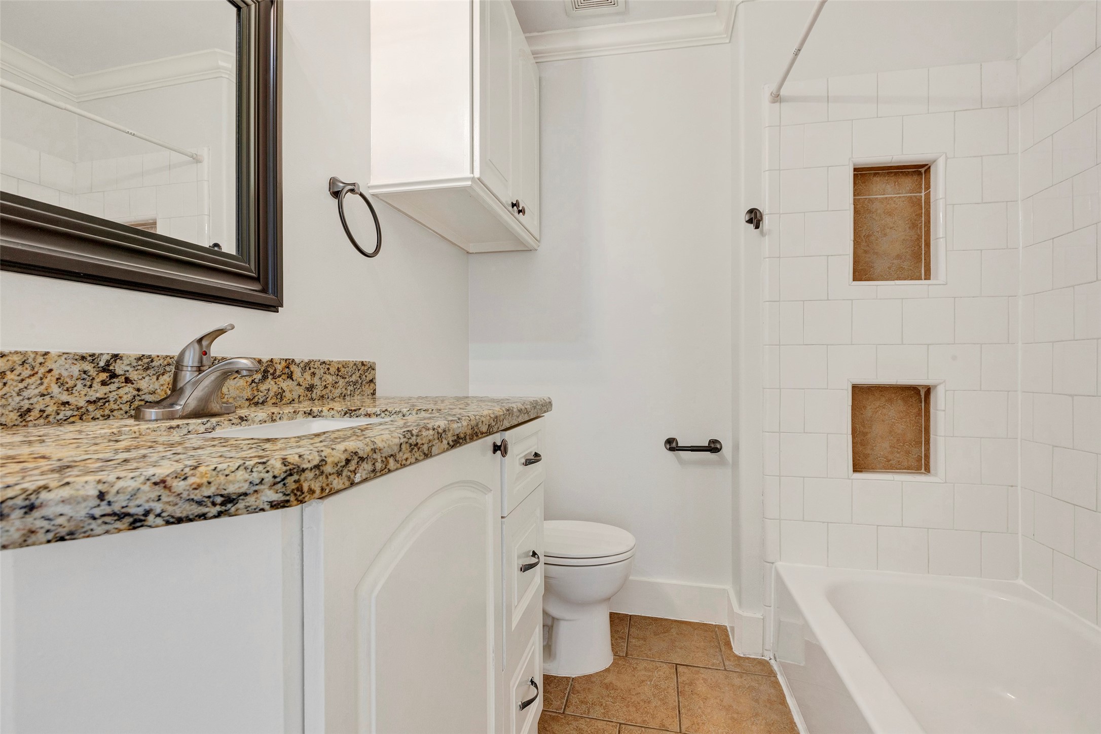 404 East 29th Street Houston, TX 77008 - Photo 5 of 9 a bathroom with a granite countertop sink toilet and shower