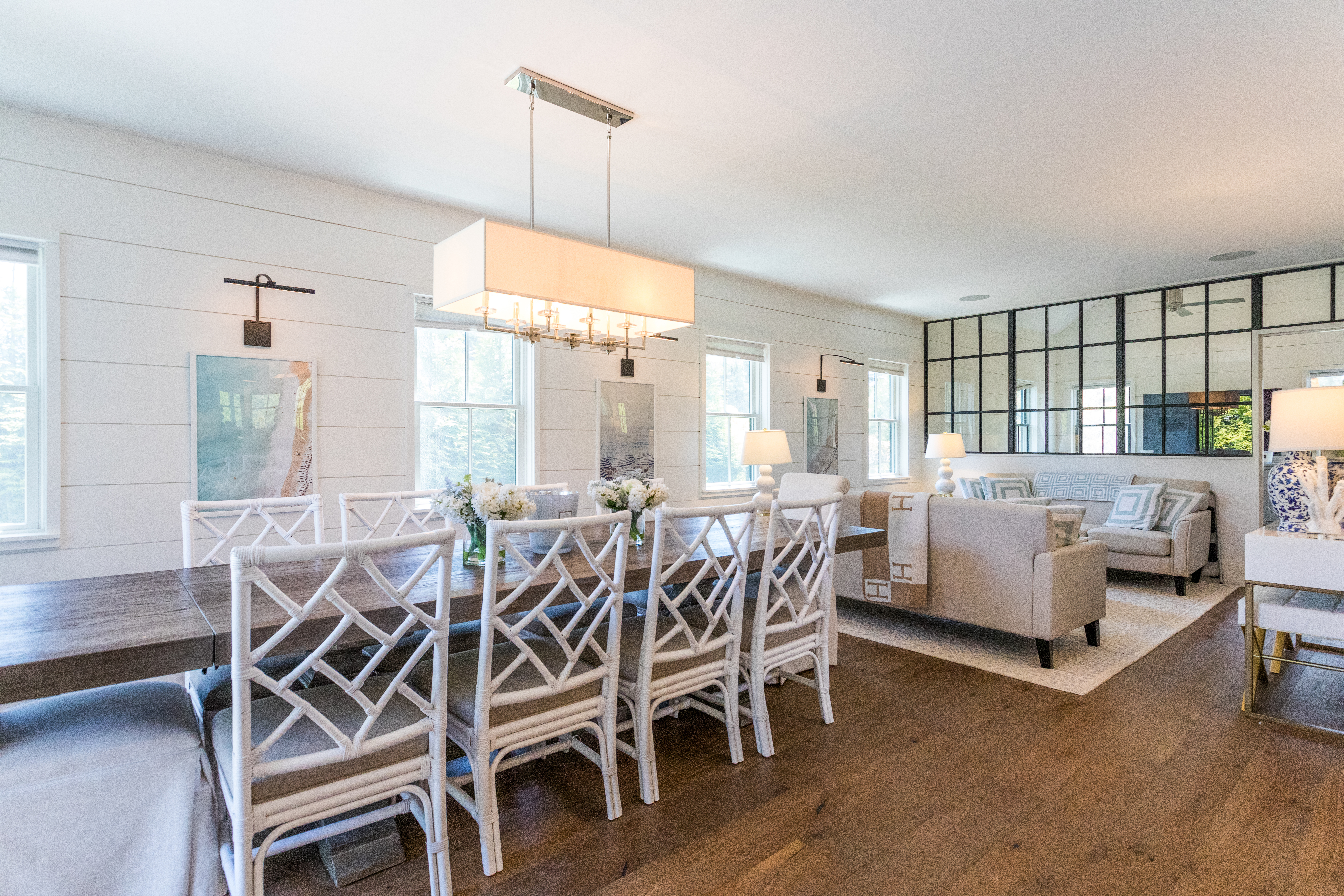 2 Wood Lily Road Nantucket, MA 02554 - Photo 7 of 38 a view of a dining room and livingroom with furniture wooden floor a rug a chandelier