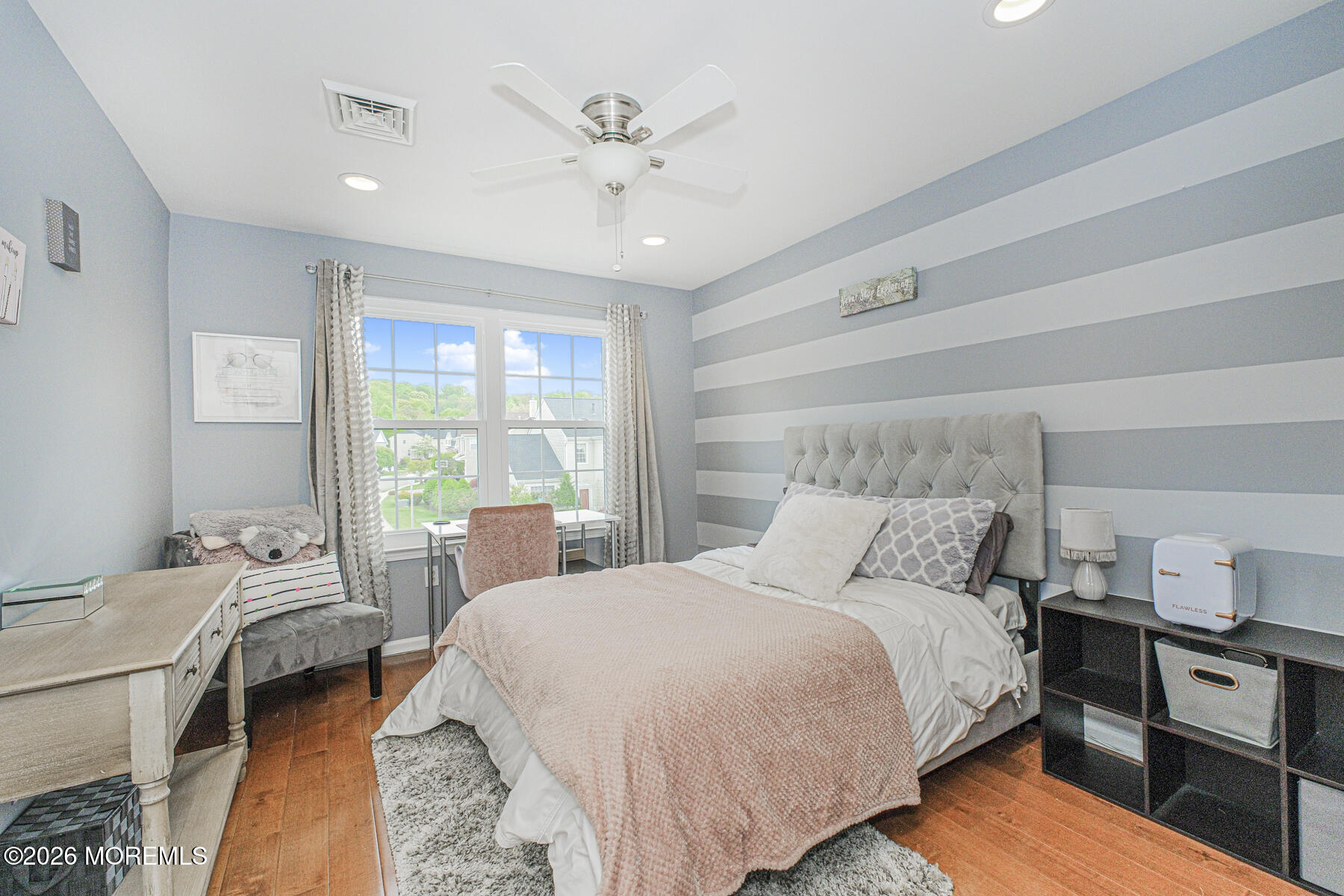 315 Wedgewood Road Morganville, NJ 07751 - Photo 26 of 37 a bedroom with a bed and wooden floor
