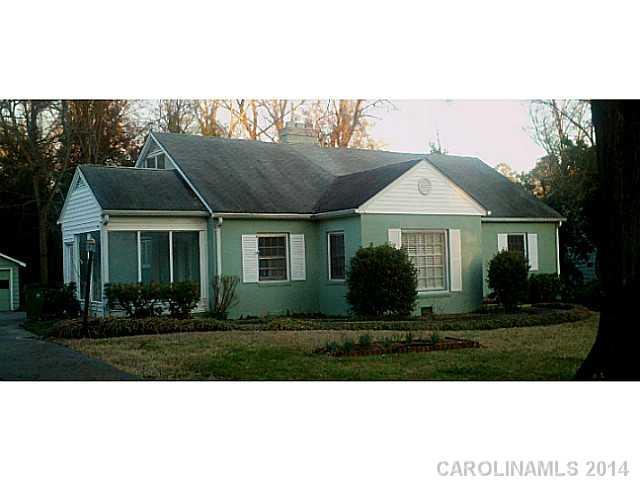 2919 Sharon Road Charlotte, NC 28211 - Photo 1 of 12 a front view of a house with a yard