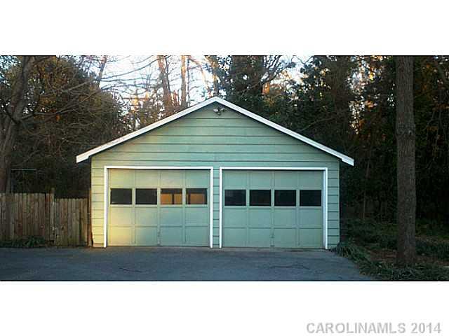2919 Sharon Road Charlotte, NC 28211 - Photo 4 of 12 a house with trees in the background