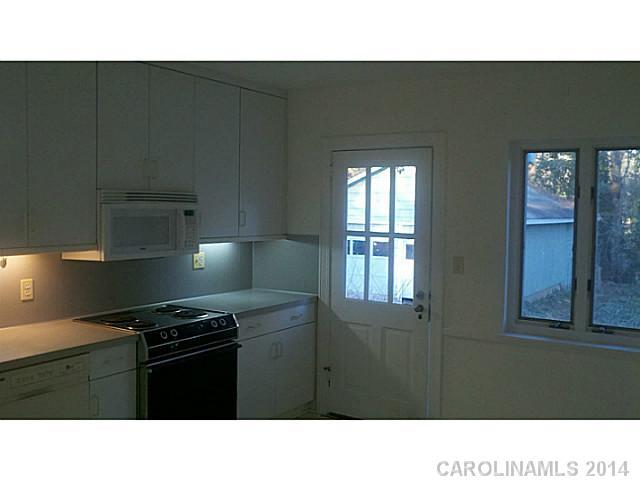 2919 Sharon Road Charlotte, NC 28211 - Photo 6 of 12 a black and white photo of a kitchen