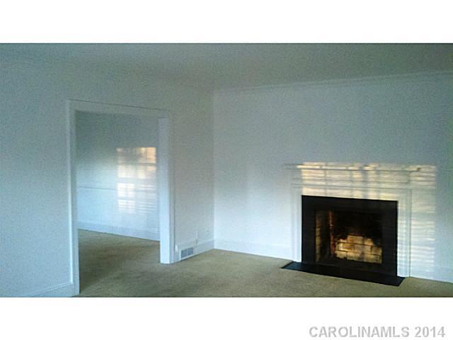 2919 Sharon Road Charlotte, NC 28211 - Photo 9 of 12 a room with a fireplace
