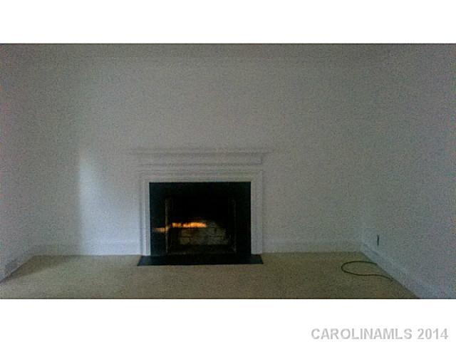 2919 Sharon Road Charlotte, NC 28211 - Photo 10 of 12 a open kitchen with a fireplace
