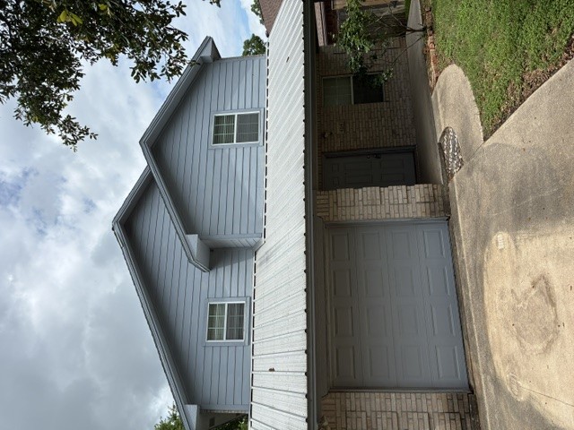 404 West 24th Street Bryan, TX 77803 - Photo 2 of 22 a front view of a house with garage