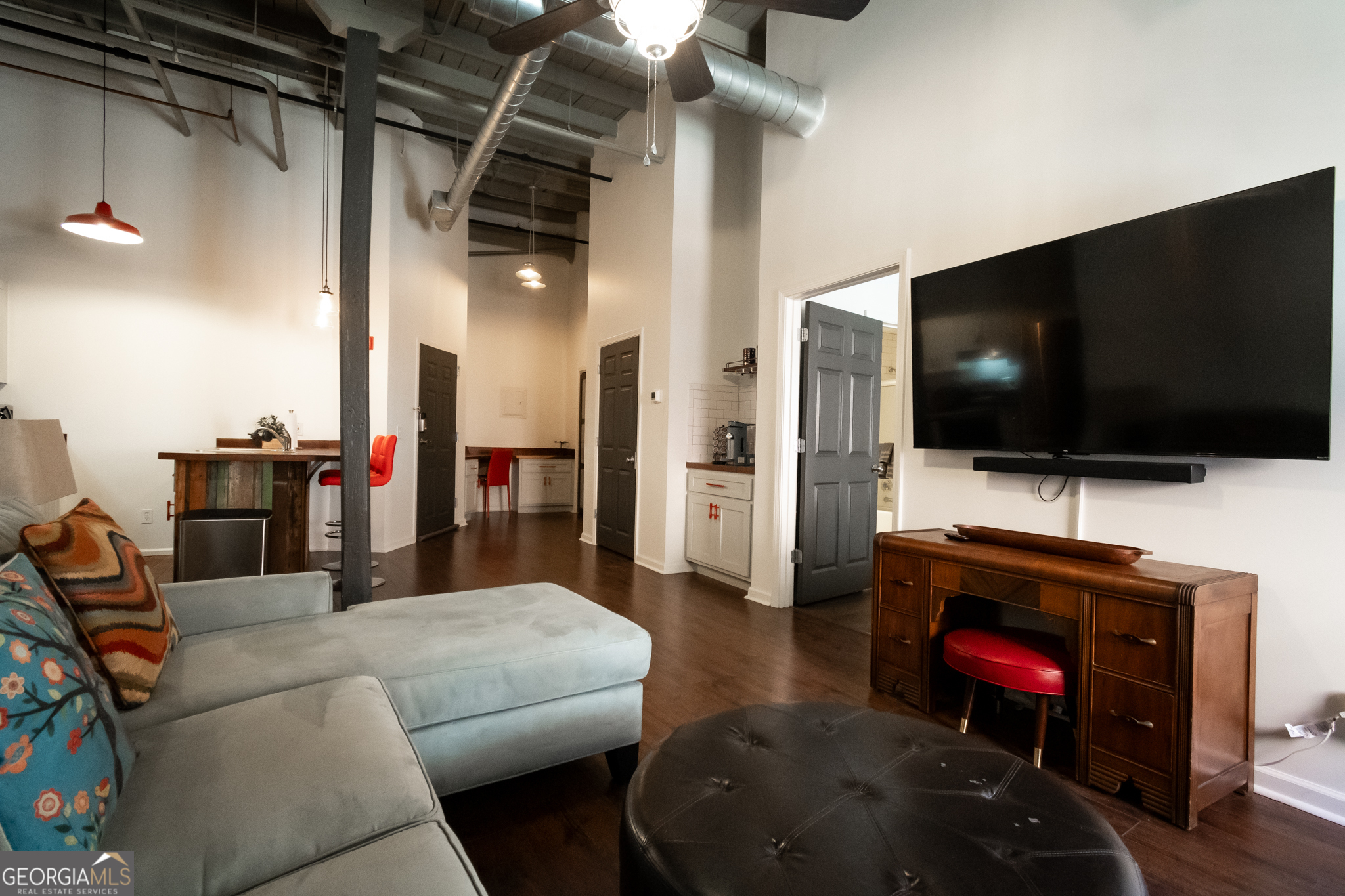 269 North Hull Street, Unit 202 Athens, GA 30601 - Photo 13 of 25 a living room with furniture and a flat screen tv