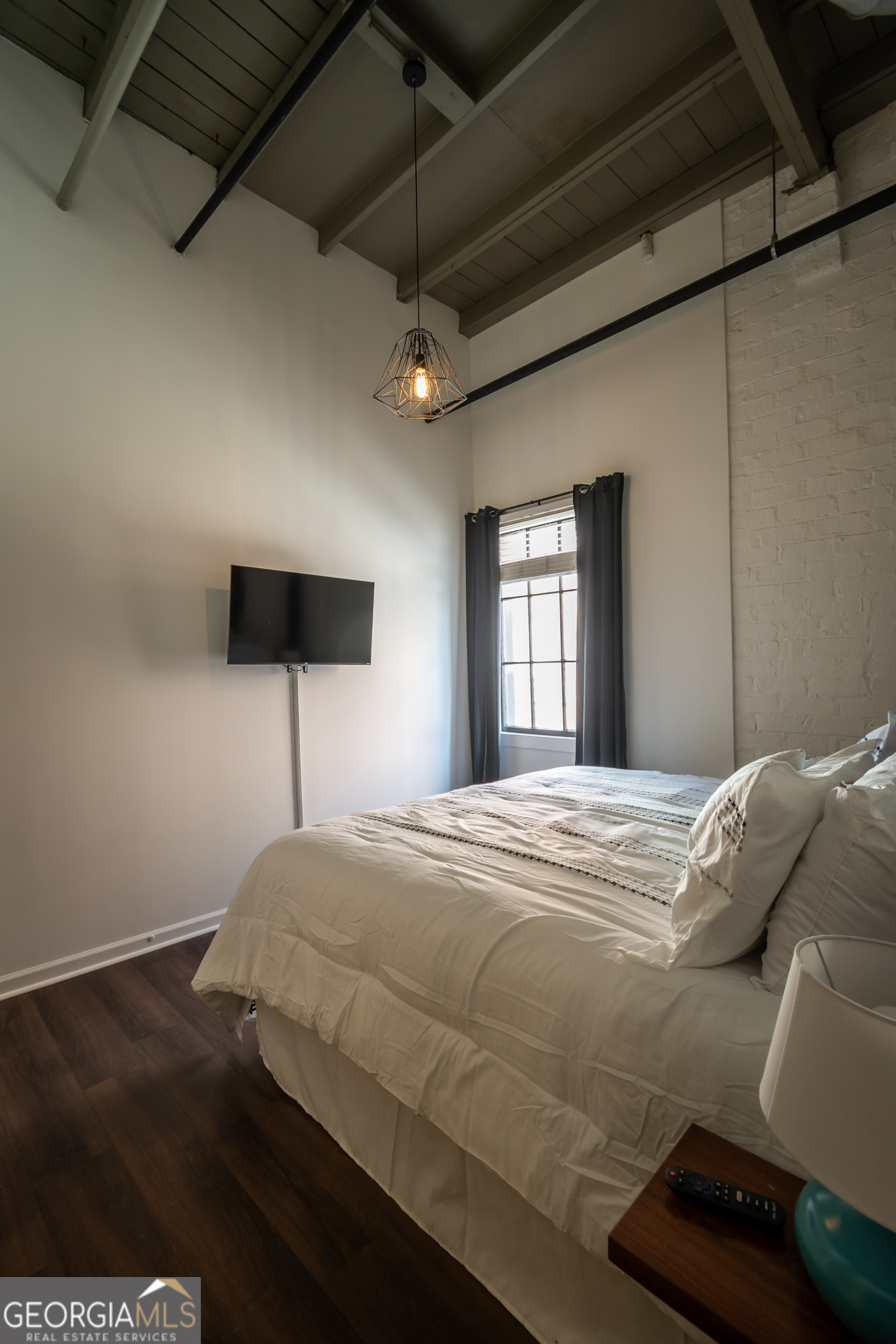 269 North Hull Street, Unit 202 Athens, GA 30601 - Photo 19 of 25 a bedroom with a bed and a flat screen tv