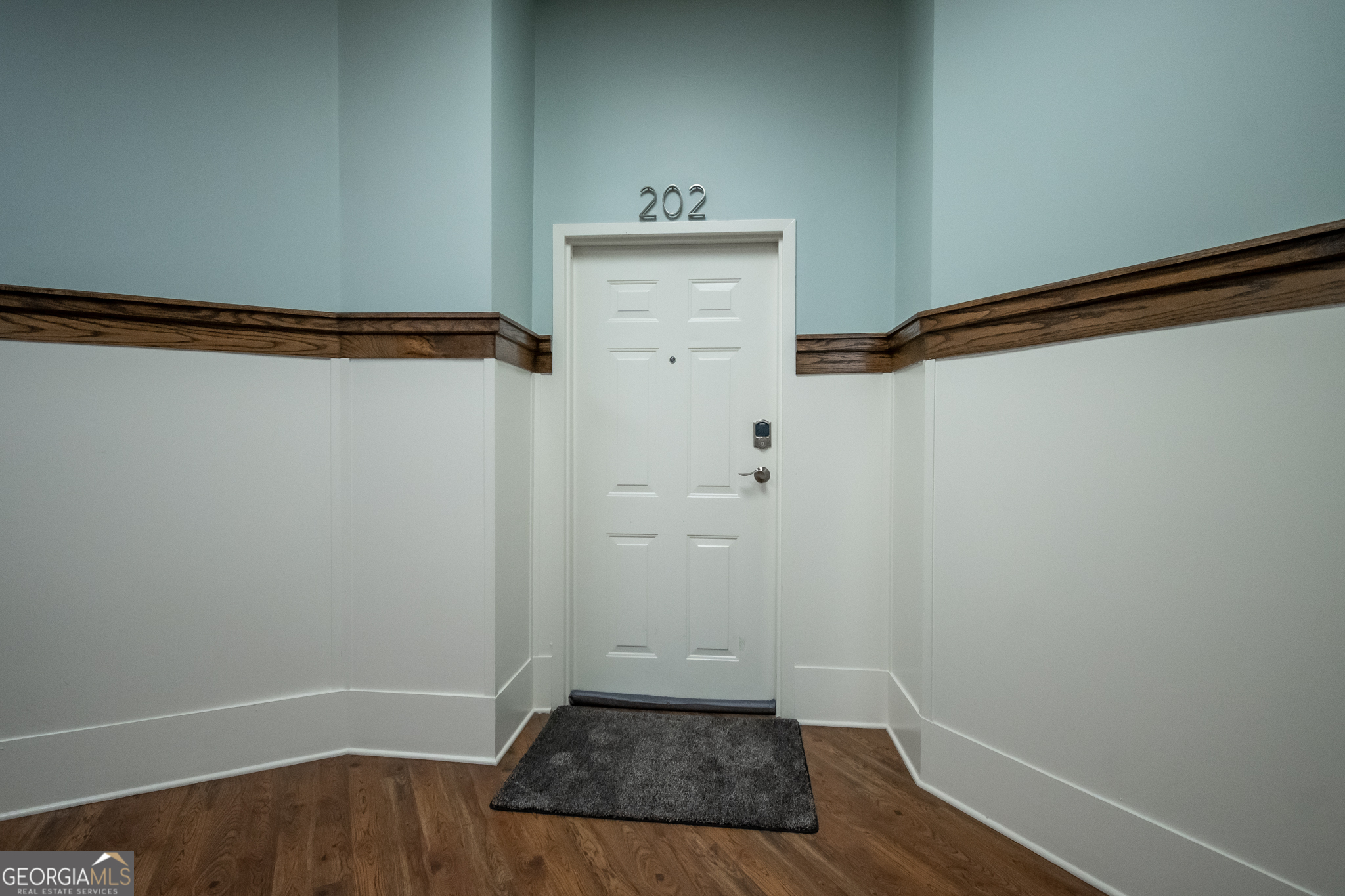 269 North Hull Street, Unit 202 Athens, GA 30601 - Photo 2 of 25 a view of walk in closet with wooden floor