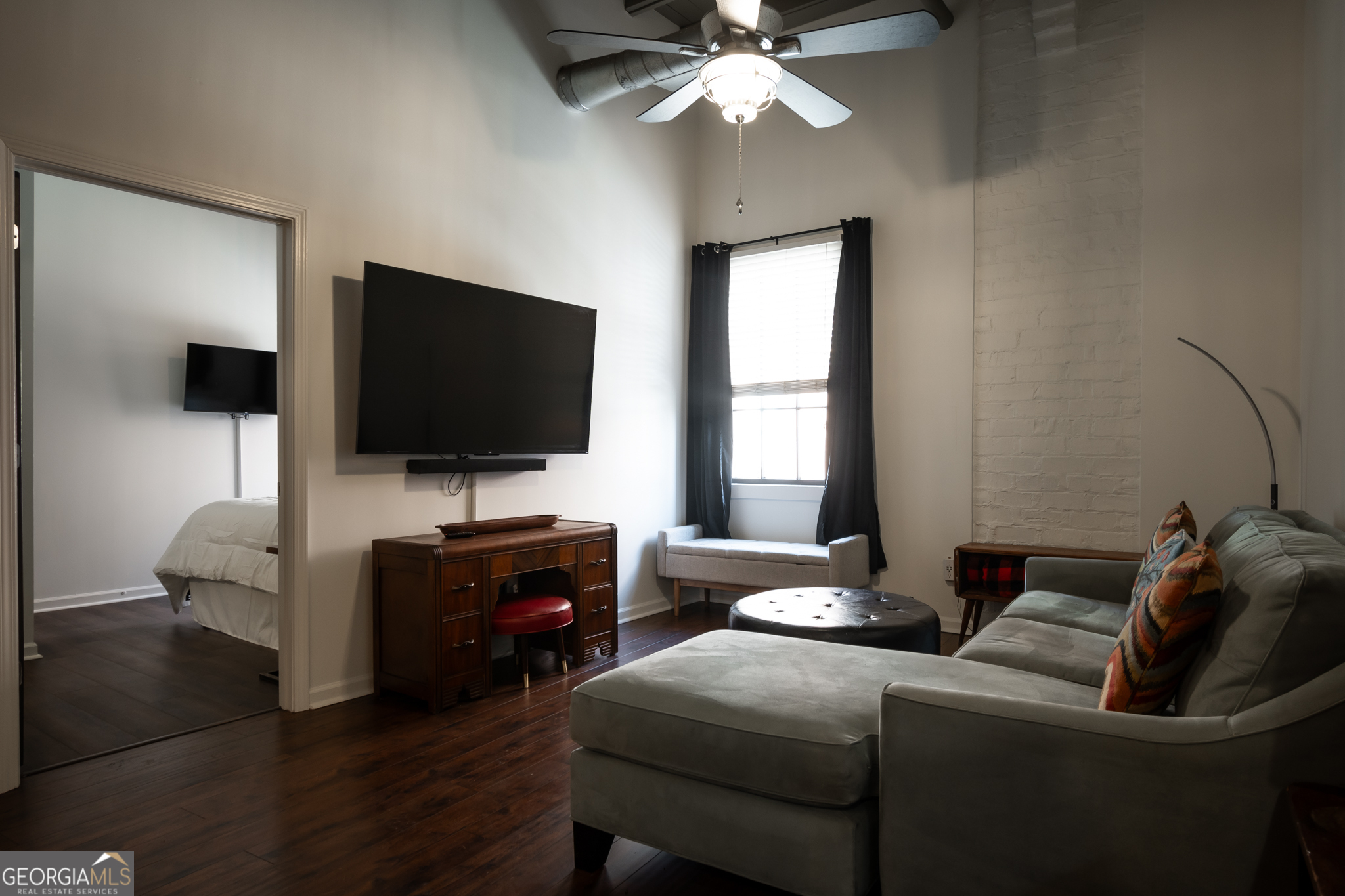 269 North Hull Street, Unit 202 Athens, GA 30601 - Photo 9 of 25 a living room with furniture and a flat screen tv