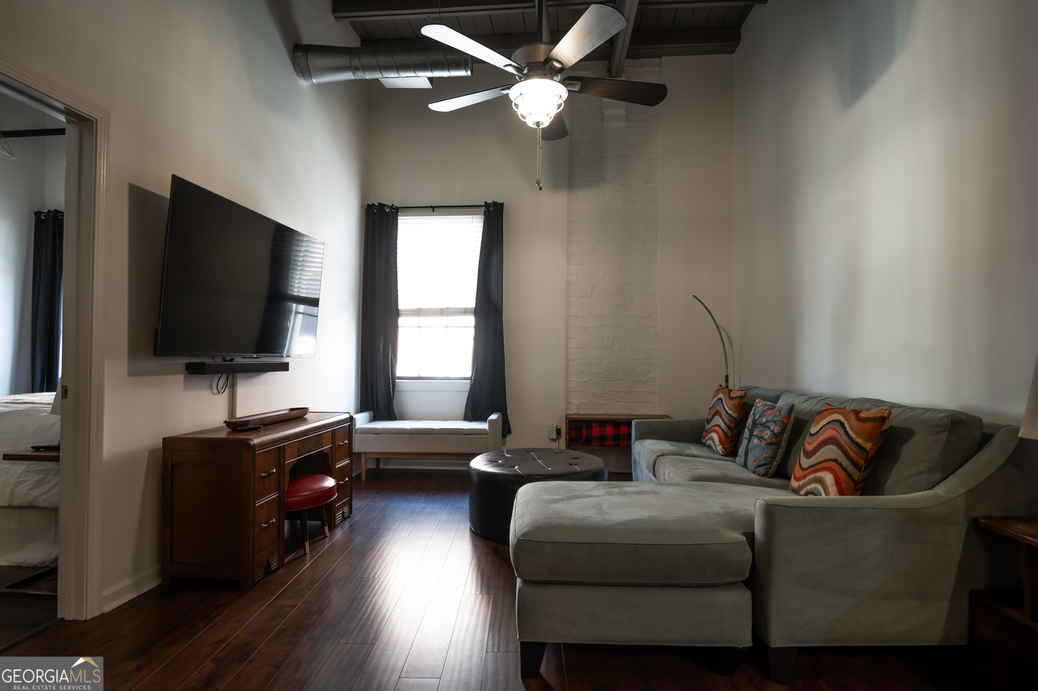 269 North Hull Street, Unit 202 Athens, GA 30601 - Photo 10 of 25 a living room with furniture and a flat screen tv