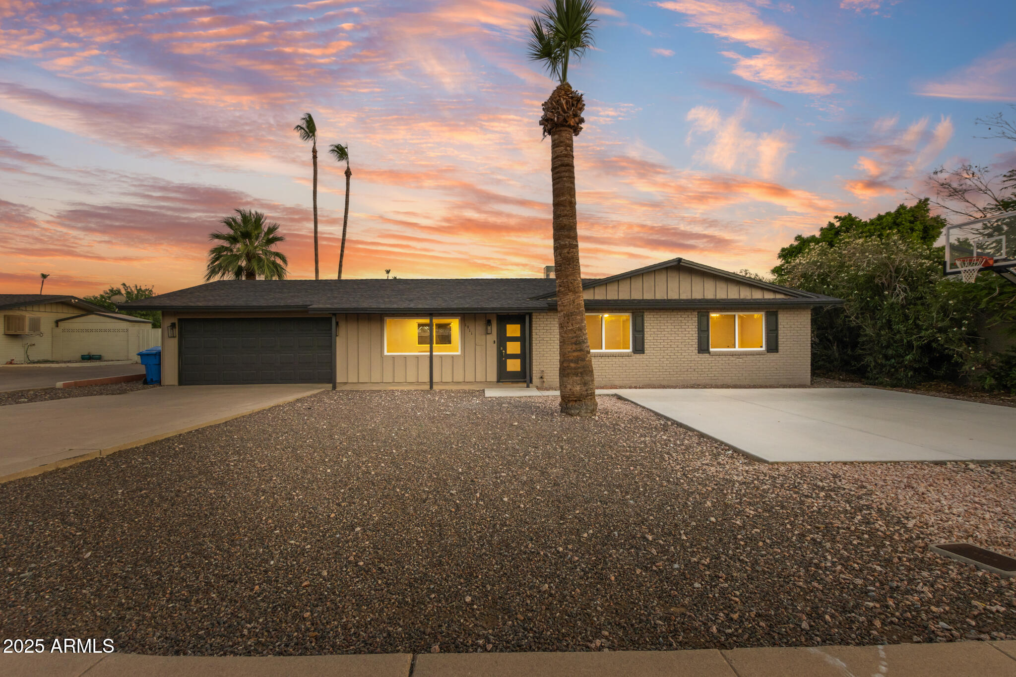 1911 East Lawrence Road Phoenix, AZ 85016 - Photo 1 of 49 a front view of a house with a garden