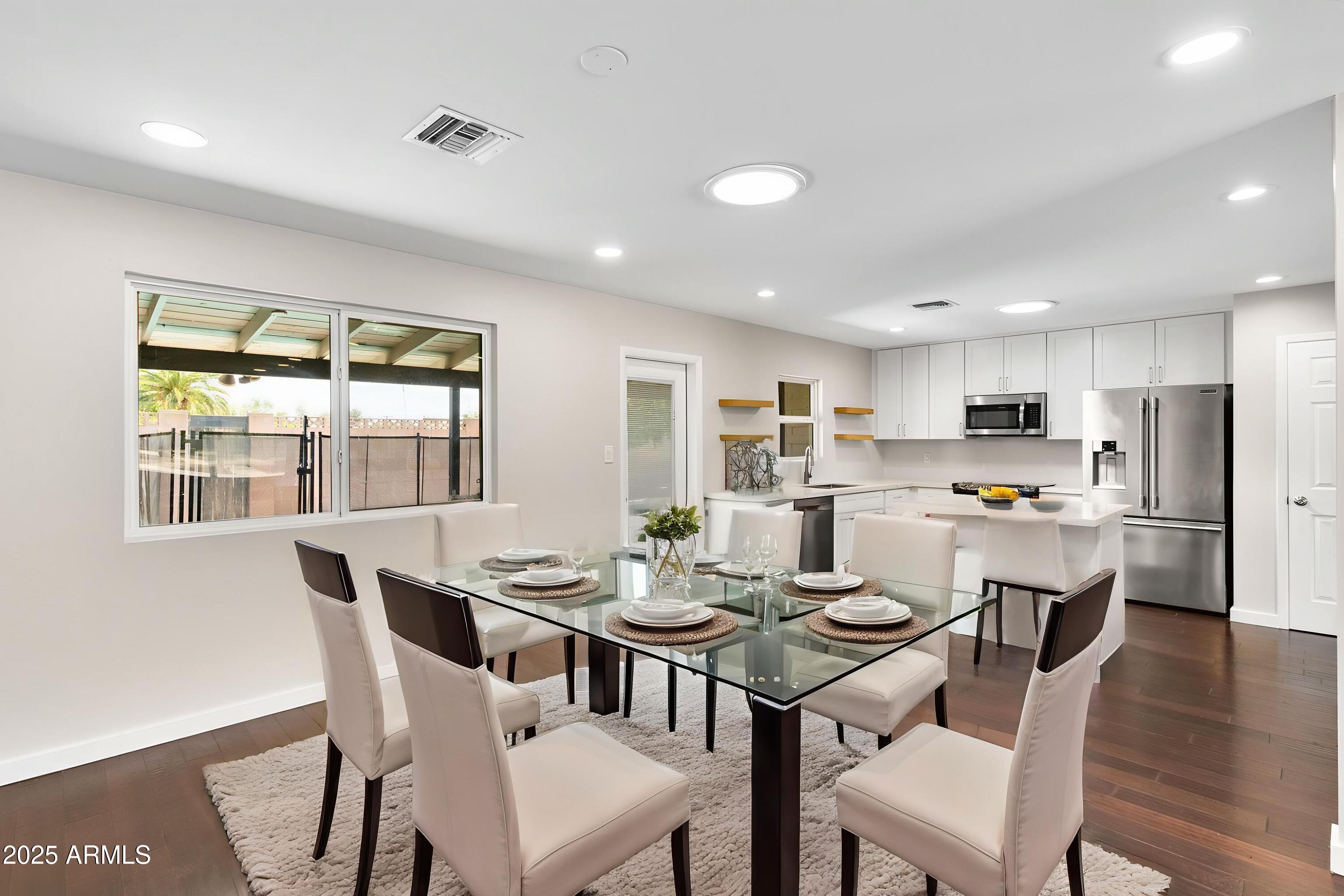 1911 East Lawrence Road Phoenix, AZ 85016 - Photo 12 of 49 a dining room with furniture and wooden floor