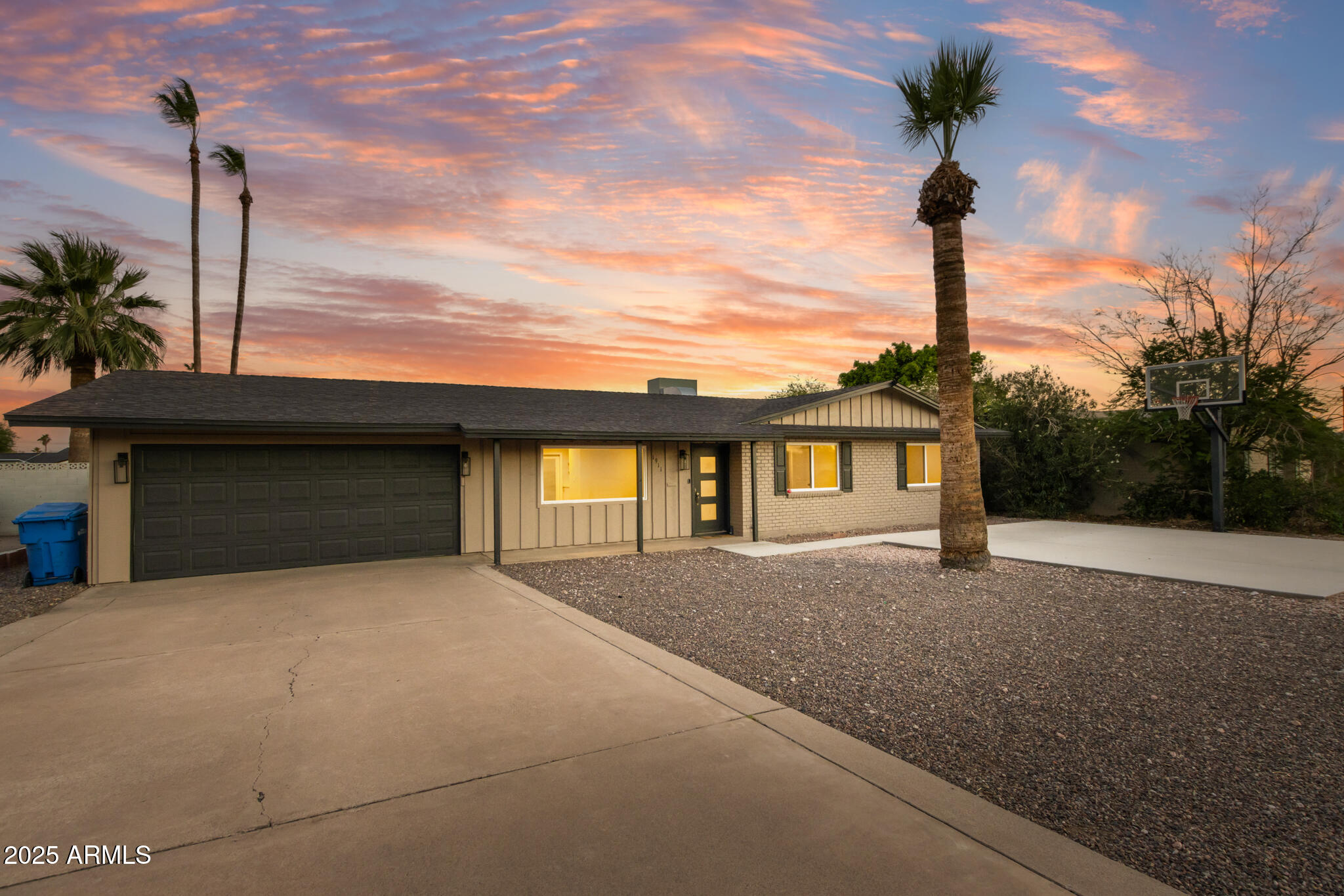 1911 East Lawrence Road Phoenix, AZ 85016 - Photo 2 of 49 a front view of a house with a yard and garage