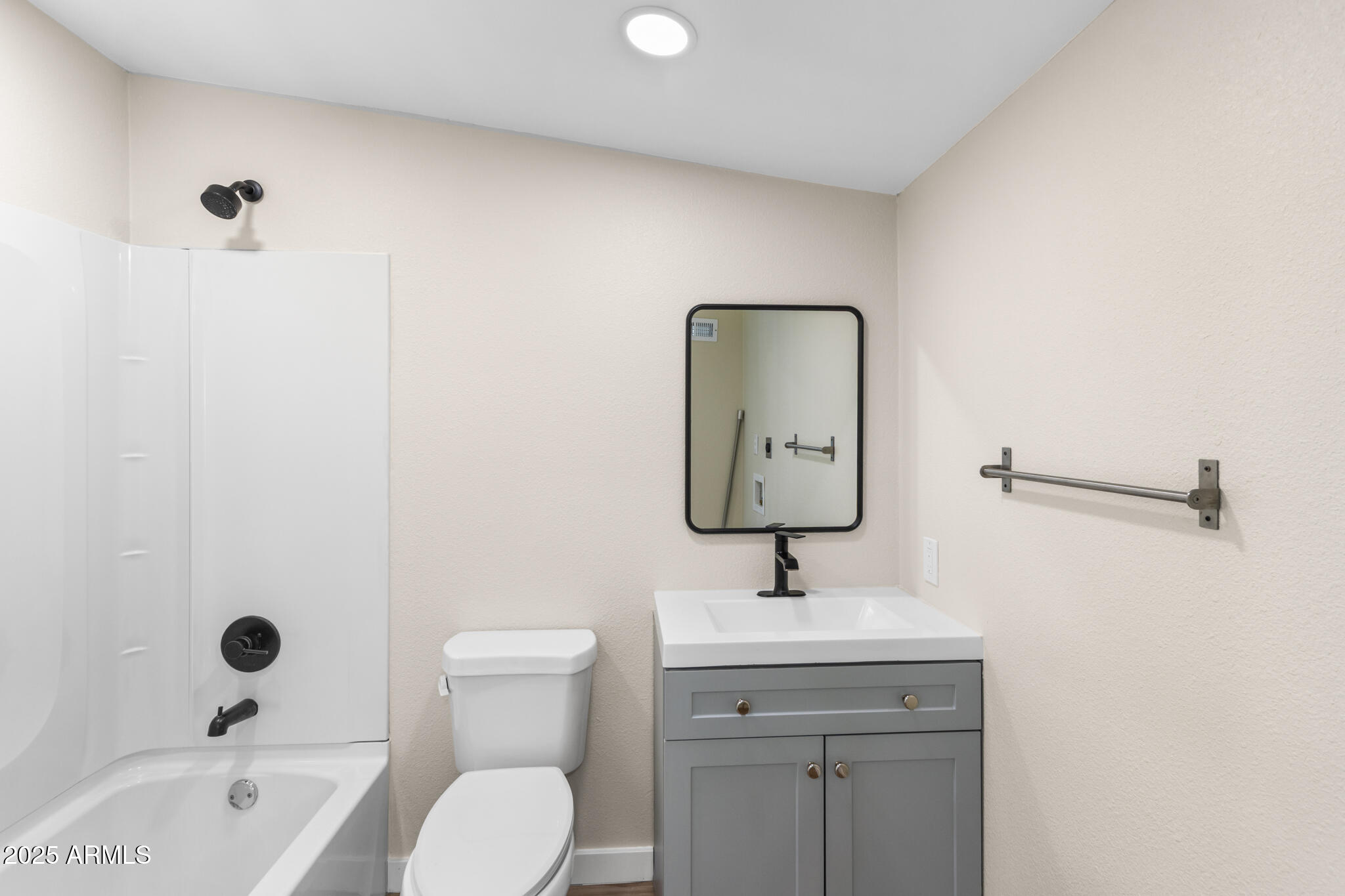 1911 East Lawrence Road Phoenix, AZ 85016 - Photo 27 of 49 a bathroom with a toilet sink and mirror